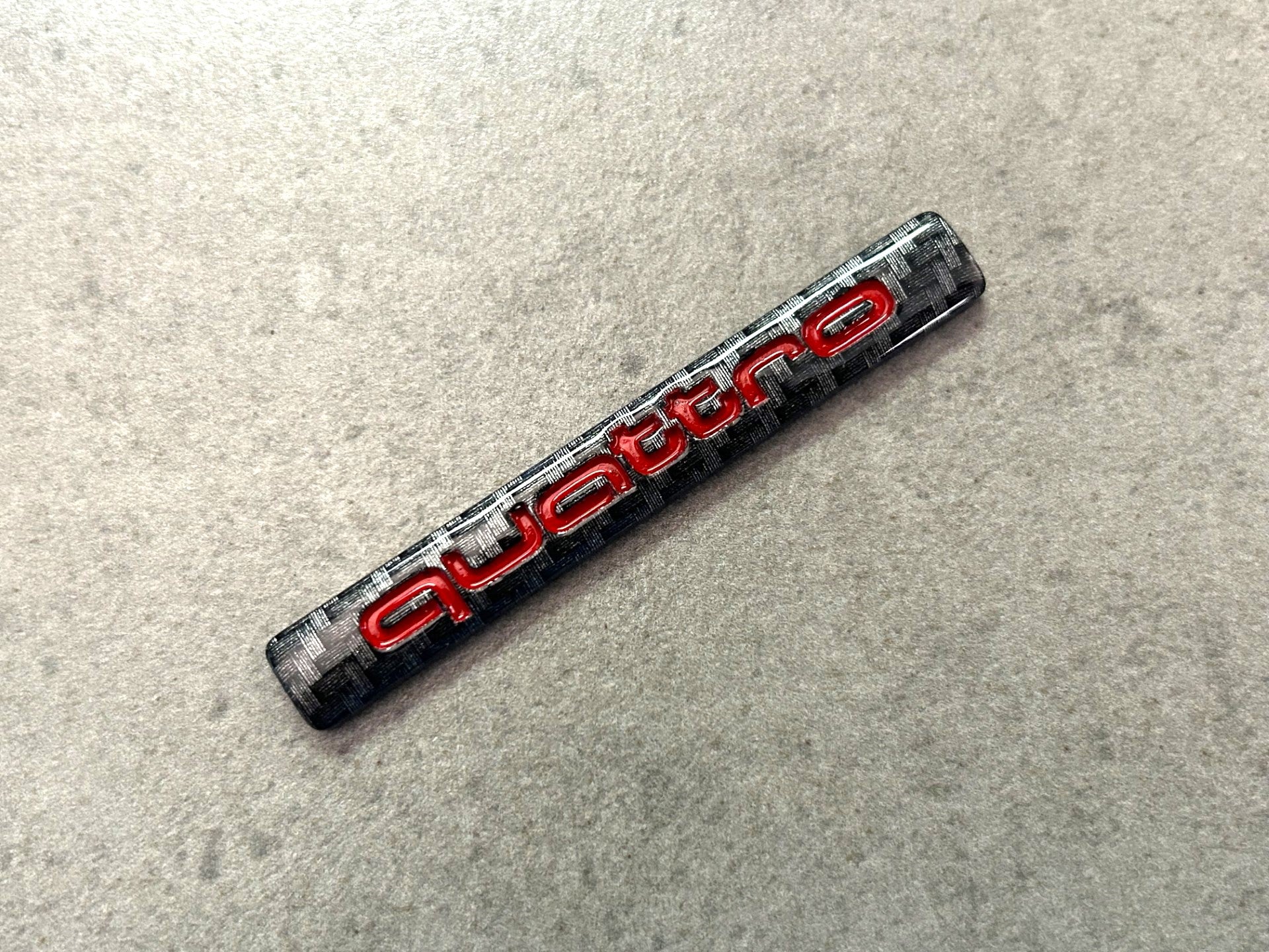 Audi Quattro Red & Black Carbon Effect Rear Emblem OEM – Deep Blue Chrome